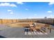 Backyard patio with an outdoor seating arrangement overlooking the fenced backyard at 2489 Alto St, Fort Lupton, CO 80621