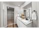 Modern bathroom with double sinks and granite countertops at 2489 Alto St, Fort Lupton, CO 80621