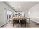 Modern dining area with stylish table, chairs, and bright kitchen in the background at 2489 Alto St, Fort Lupton, CO 80621