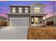 Charming two-story home featuring a covered front porch and a two-car garage at 2489 Alto St, Fort Lupton, CO 80621