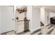 A finished basement features a bar with storage and a small refrigerator at 7120 Galapago St, Denver, CO 80221