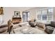 Bright living room with hardwood floors, modern furniture, and lots of natural light at 7120 Galapago St, Denver, CO 80221