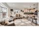 Spacious living area flows into a modern kitchen, perfect for entertaining guests at 7120 Galapago St, Denver, CO 80221