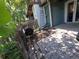 Backyard featuring a stone patio, privacy fence, and outdoor storage at 10298 W Dartmouth Ave, Lakewood, CO 80227