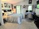 Cozy bedroom featuring neutral tones, natural light, and dedicated office space at 10298 W Dartmouth Ave, Lakewood, CO 80227