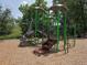 A community playground featuring a slide, climbing bars, steps, and mushroom shades at 10298 W Dartmouth Ave, Lakewood, CO 80227