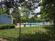 Community pool area complete with seating and manicured landscaping at 10298 W Dartmouth Ave, Lakewood, CO 80227