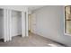 Carpeted bedroom with closet and natural light at 7870 W 87Th Dr # J, Arvada, CO 80005