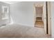 Bright, carpeted bedroom with a large window providing ample natural light at 7870 W 87Th Dr # J, Arvada, CO 80005
