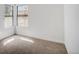 This cozy bedroom offers plush carpet and natural light from two windows at 7870 W 87Th Dr # J, Arvada, CO 80005