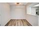 Bright dining space with hard wood floors and a pass through to the kitchen at 7870 W 87Th Dr # J, Arvada, CO 80005