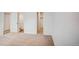 Carpeted hallway that gives way to the bathroom at 7870 W 87Th Dr # J, Arvada, CO 80005