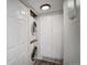 Convenient laundry area features stacked washer and dryer next to storage space at 7870 W 87Th Dr # J, Arvada, CO 80005