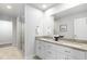 Modern bathroom with double vanity and large mirror at 2952 S Delaware St, Englewood, CO 80110