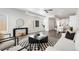 Open-concept living room with modern decor, a stylish rug, and plenty of natural light at 2952 S Delaware St, Englewood, CO 80110