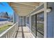 Sunny balcony with sliding glass doors, railing and ample space at 8335 Fairmount Dr # 102, Denver, CO 80247