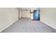 View of the living room with a kitchen and exterior door at 8335 Fairmount Dr # 102, Denver, CO 80247