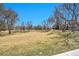 Expansive open space with mature trees and clear blue skies at 8335 Fairmount Dr # 102, Denver, CO 80247