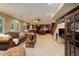 Inviting finished basement with multiple seating areas, kitchen, and staircase for easy access to upper floors at 10032 Astoria Ct, Lone Tree, CO 80124