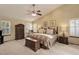 Warm bedroom with vaulted ceilings, plush carpeting, and a decorative ceiling fan at 10032 Astoria Ct, Lone Tree, CO 80124