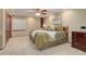 Cozy bedroom featuring neutral tones, carpet flooring, and a ceiling fan for added comfort at 10032 Astoria Ct, Lone Tree, CO 80124