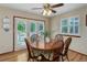 Cozy breakfast nook with wood floors, a round table, and french doors that lead to the outdoors at 10032 Astoria Ct, Lone Tree, CO 80124