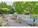 The deck features a stainless steel grill, comfortable seating, and lush green surroundings at 10032 Astoria Ct, Lone Tree, CO 80124