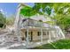 Charming home featuring a spacious wooden deck with green umbrellas and a covered patio, perfect for outdoor relaxation and entertaining at 10032 Astoria Ct, Lone Tree, CO 80124