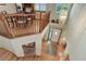 View from the top of the stairs showing the foyer with front door and chandelier at 10032 Astoria Ct, Lone Tree, CO 80124