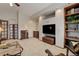 Spacious living room featuring carpeted floors, a wet bar, and a large TV at 10032 Astoria Ct, Lone Tree, CO 80124