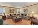 Cozy living room with plush sofas, hardwood floors, and elegant decor at 10032 Astoria Ct, Lone Tree, CO 80124