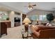 Spacious living room featuring vaulted ceilings, large windows and stylish decor at 10032 Astoria Ct, Lone Tree, CO 80124
