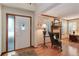 Cozy living room featuring a fireplace, hardwood floors, and a decorative front door at 10032 Astoria Ct, Lone Tree, CO 80124