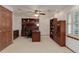 Functional home office featuring built-in shelving, a spacious desk, and ample natural light for productivity at 10032 Astoria Ct, Lone Tree, CO 80124