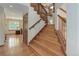 Elegant wood staircase with natural light and open floor plan at 10032 Astoria Ct, Lone Tree, CO 80124