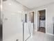 Modern bathroom with tiled walk-in shower and access to a walk-in closet at 16611 E 119Th Ave # E, Commerce City, CO 80022