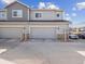 Townhouse with garage and well-kept exterior and shared driveway at 16611 E 119Th Ave # E, Commerce City, CO 80022