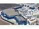 Commercial complex aerial view, featuring extensive parking and multiple storefronts at 860 S 7Th Ave, Brighton, CO 80601