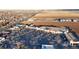 Expansive view of a shopping center near farmland, featuring numerous storefronts and parking at 860 S 7Th Ave, Brighton, CO 80601