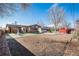 This is a back yard with gravel walkways and a dirt groundcover at 860 S 7Th Ave, Brighton, CO 80601