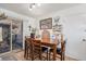 Cozy dining room featuring a wood table with seating for four, adjacent to sliding glass door at 860 S 7Th Ave, Brighton, CO 80601