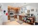 Functional kitchen with stainless steel appliances, wooden cabinets, and tile flooring at 860 S 7Th Ave, Brighton, CO 80601