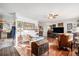 Spacious living room with hardwood floors and bright natural light, adjacent to the kitchen at 860 S 7Th Ave, Brighton, CO 80601