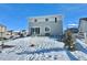 Private backyard with patio and snowy landscape at 3734 Makley Cir, Castle Rock, CO 80104