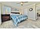 Bright bedroom with a double bed, carpeted floor, and ceiling fan at 3734 Makley Cir, Castle Rock, CO 80104