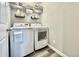 Convenient laundry room with washer, dryer, and shelving at 3734 Makley Cir, Castle Rock, CO 80104