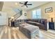 Living room with L-shaped sofa and a staircase at 3734 Makley Cir, Castle Rock, CO 80104