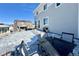 Cozy patio with seating area in a snowy backyard setting at 3734 Makley Cir, Castle Rock, CO 80104