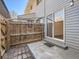 Fenced-in back patio features a sliding glass door at 1922 S Oswego Way, Aurora, CO 80014