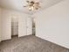 Spacious bedroom featuring neutral paint, closet and a ceiling fan for added comfort at 1922 S Oswego Way, Aurora, CO 80014